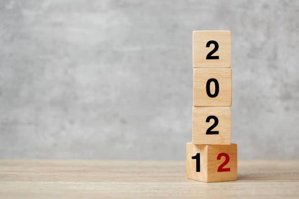 istock block flipping 2021 to 2022 text on table. Resolution, strategy, plan, goal, motivation, reboot, business and New Year holiday concepts 1352197382