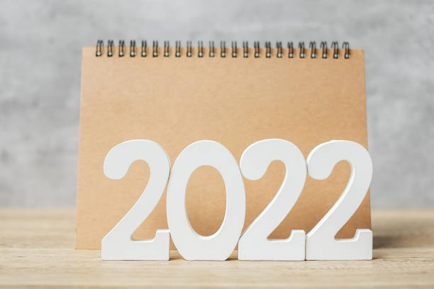 istock 2022 Happy New Year with blank notebook and wooden number. countdown, Resolution, Goals, Plan, Action and Mission Concept 1352197531