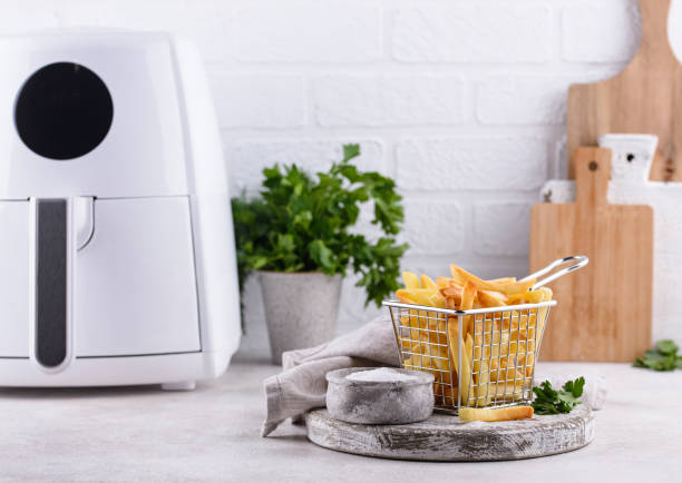 istock French fries cooked in air fryer. 1352201873