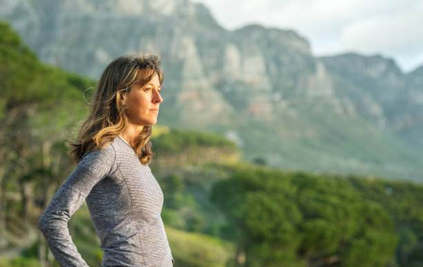 Fit young woman looking at the view during a mountain hike