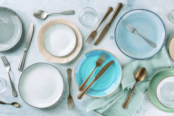istock Modern tableware set with cutlery and a vibrant blue plate 1352202449