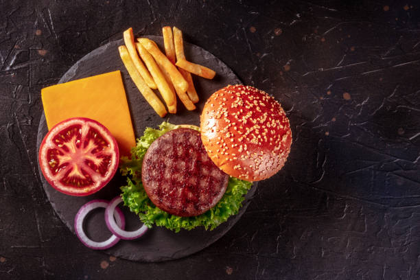 istock Hamburger ingredients, overhead shot with a place for text 1352202467