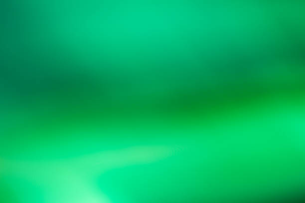 istock Blurry gadient green abstract blurred background frosted jade texture 1352204273