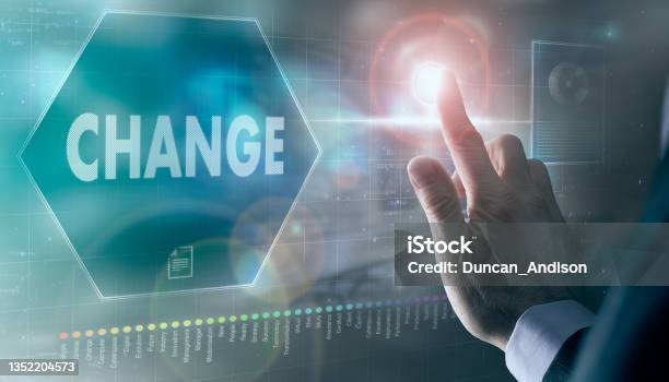A Businessman Controlling A Futuristic Display With A Change Concept On It Stock Photo - Download Image Now
