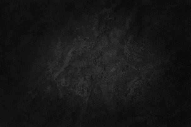 istock Dark gray black slate stone wall texture background in natural pattern for decorative interior and exterior. 1352205023