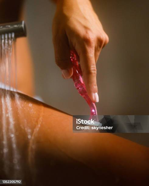 Woman Shaving Her Leg In The Bathroom Stock Photo - Download Image Now - Shaving, Hair Removal, Shower
