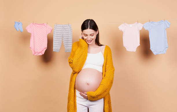 Image of a beautiful young cute pregnant emotional woman. stock photo