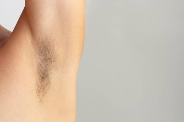 istock Woman hairy unshaved armpit on the white background with copy space 1352210415