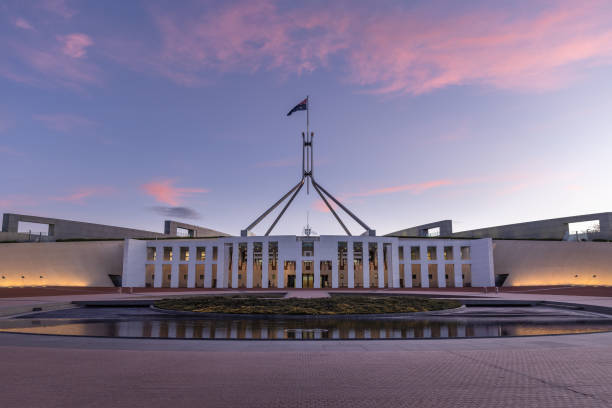 a sunset shot of federal parliament house at canberra - parliament building fotos imagens e fotografias de stock