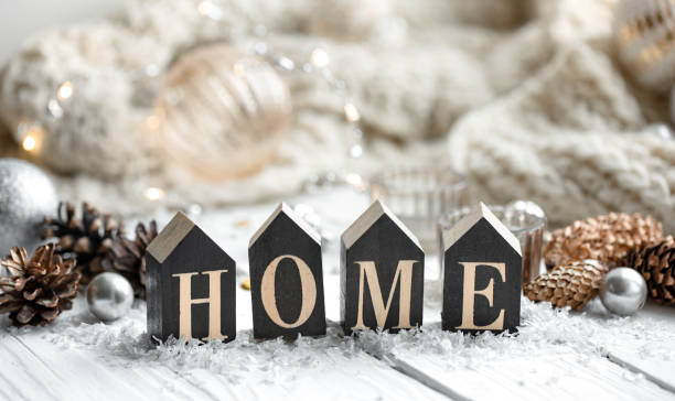 istock Cozy winter background with decorative wooden word home. 1352214564