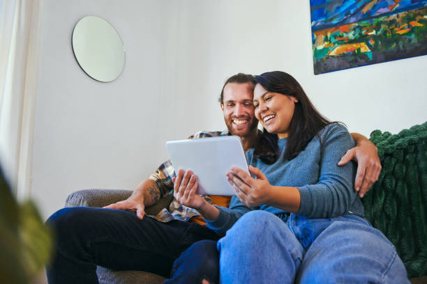 istock Shot of a young couple using their digital tablet together 1352214599
