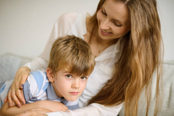 istock six year old boy with mom 1352216392