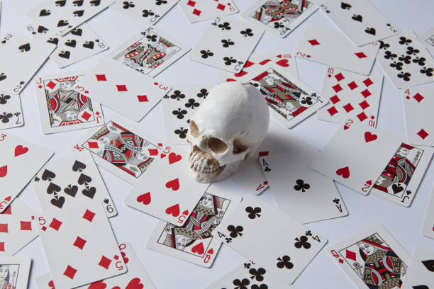 istock Human skull and deck of cards 1352216719