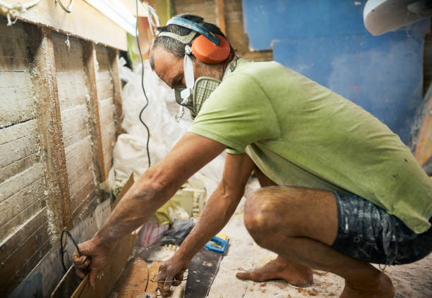 istock Shot of a mature carpenter crouching down in his shed to get tools 1352218712