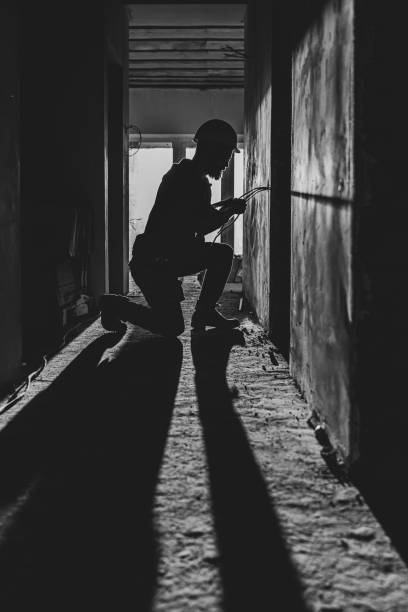 istock Worker is cutting wires with lineman's pliers. 1352218988