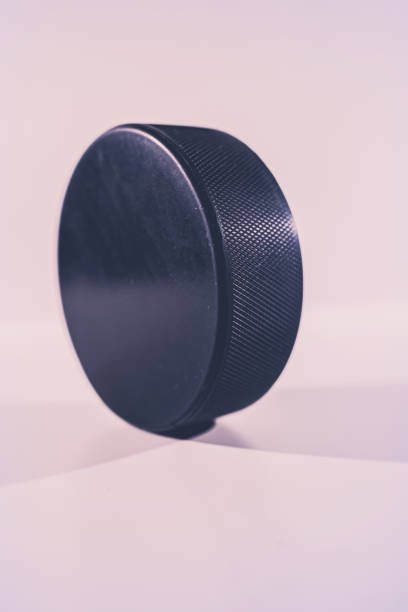 istock Hockey puck on a white background. Macro 1352219254