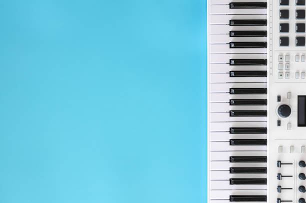 istock Musical background with musical keys on blue, flat lay, copy space. 1352220980