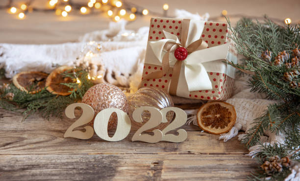 Christmas composition with decorative numbers 2022 and decor details.