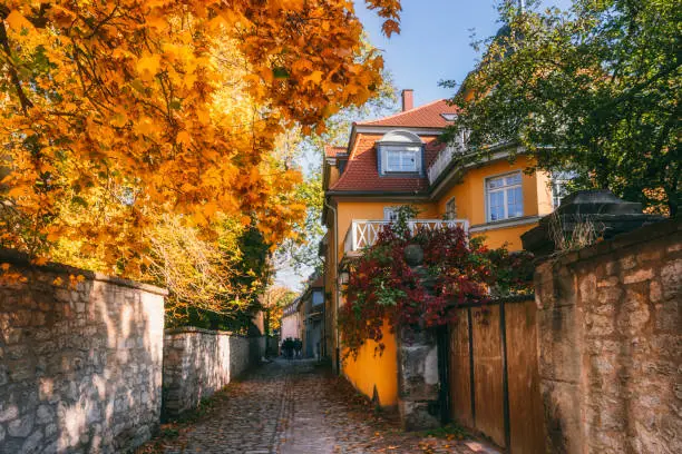 Small road with medieval houses in Weimar, Germany in autumn