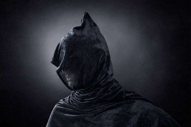 istock Creepy figure over dark misty background 1352222890