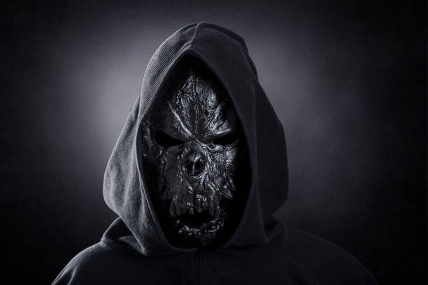 istock Monster in hooded cloak at night 1352223040