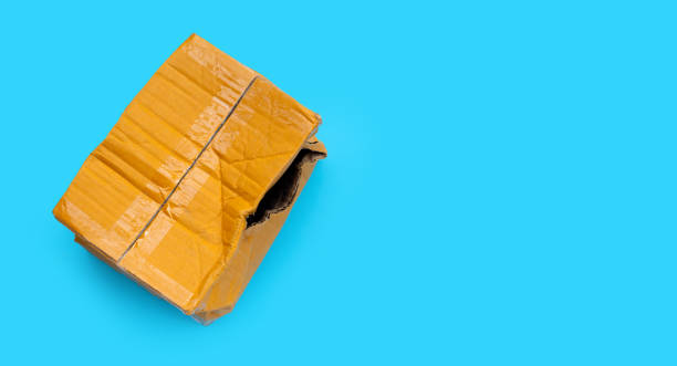 istock Damaged cardboard box with hole 1352223160