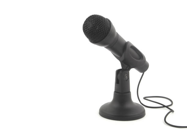 istock Black microphone on stand isolated on white 1352223603