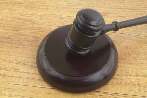istock Judge's gavel on wooden table 1352224406