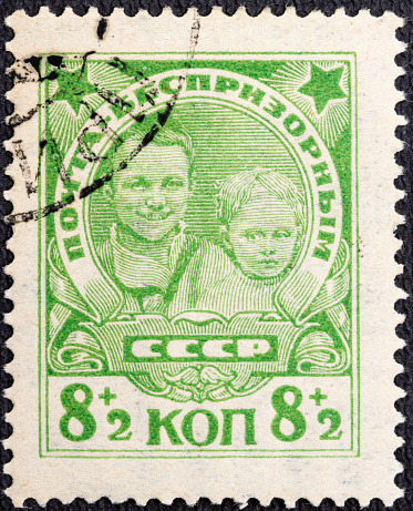 RUSSIA - CIRCA 1927: stamp printed in the USSR Soviet Union . Street children.