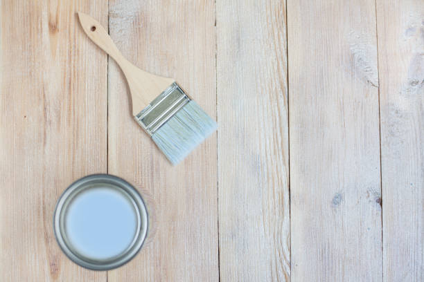 istock brush and jar with paint on a wooden background 1352224622