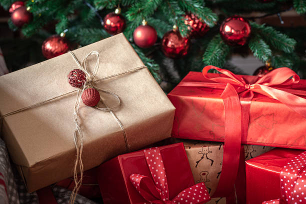 istock Close-up of red gift boxes near the Christmas tree. 1352224862