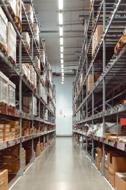 istock Huge distribution warehouse with high shelves. Warehouse interior. 1352225850