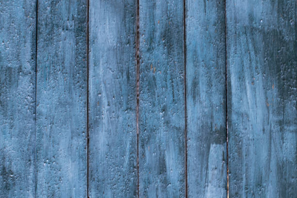 istock Textured background from blue wooden planks. 1352226068