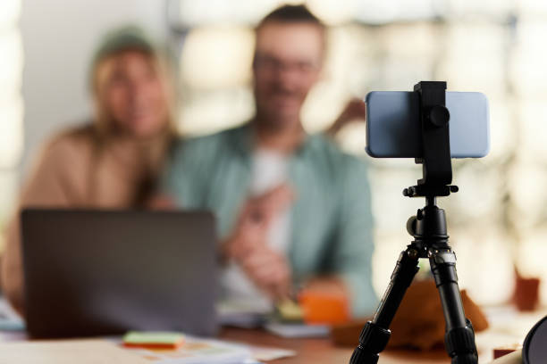 istock Cell phone on a tripod during live broadcast. 1352226188