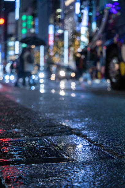 istock Night street with rain and light reflections 1352226589
