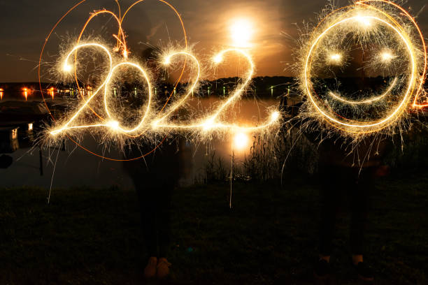 istock Sparkler Happy New Year 2022 With Fireworks 1352230250