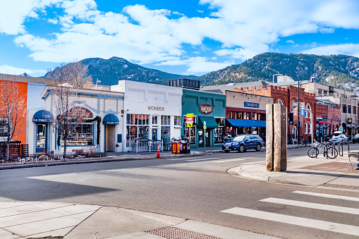 Boulder, USA - December 25, 2019: View of the Pearl Street Mall, a landmark pedestrian area in downtown Boulder, Colorado, in the Rocky Mountains.