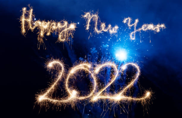 istock Sparkler Happy New Year 2022 With Fireworks 1352230507