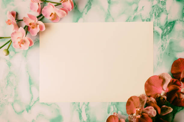 istock Invitation created with frames with flowers and green marble background. 1352230714
