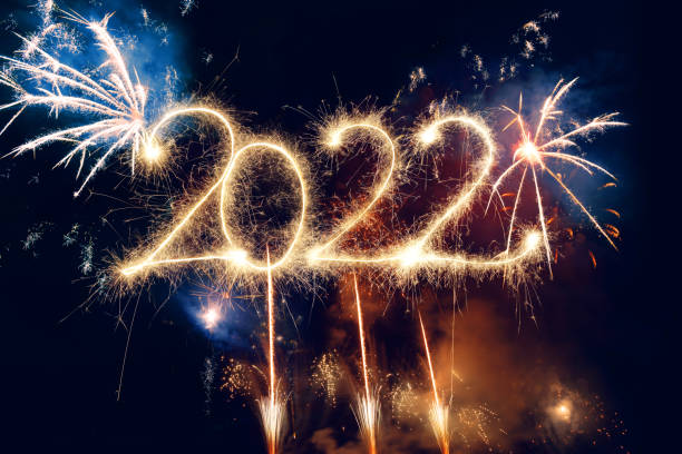 istock Sparkler Happy New Year 2022 With Fireworks 1352230757