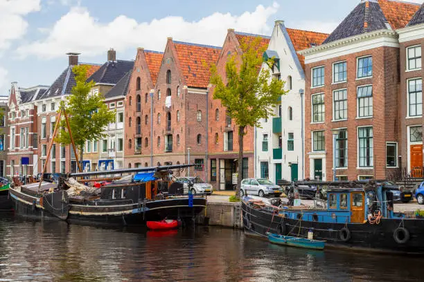 Historic ships, canal houses and warehouses on the Hoge der aa canal in Groningen, Netherlands