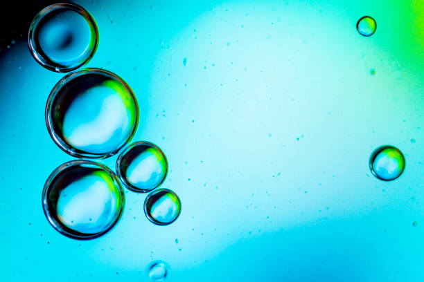 istock oil drops on a water surface abstract background with blue colors. 1352233175
