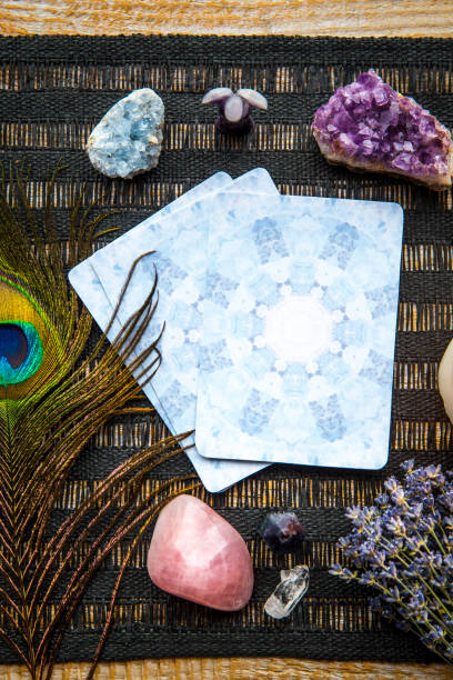istock Deck with divination homemade Angel cards on black table, surrounded with semi precious stones crystals. 1352233194