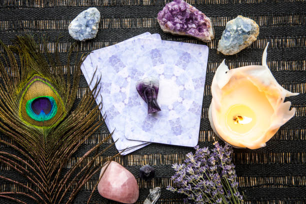 istock Deck with divination homemade Angel cards on black table, surrounded with semi precious stones crystals. 1352233195