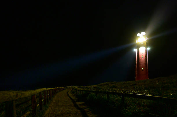 istock Texel lighthouse in the dunes during a stormy autumn night 1352233282