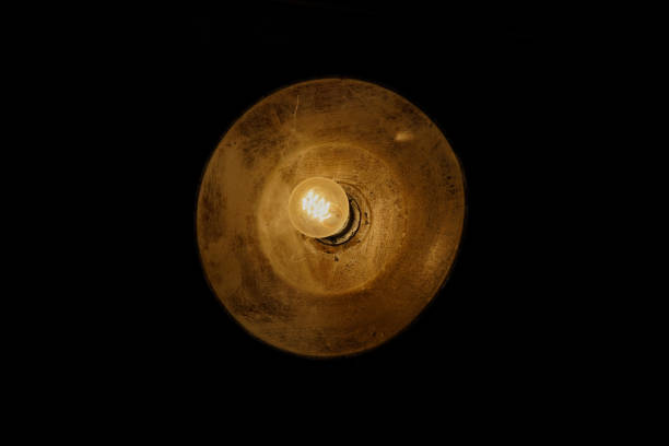 istock Old-fashioned copper tungsten lamp bulb 1352233286