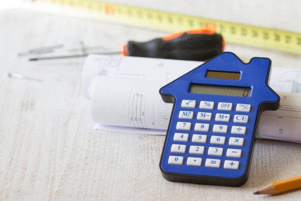 istock Calculator, plans and DIY tools on light background, home renovation and construction concept 1352234875