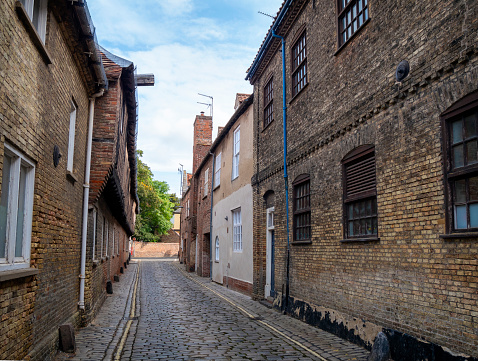 On the left is the exterior of the Hanse House in St Margaret’s Lane in King’s Lynn, Norfolk, Eastern England. The Hanse House was acquired by German merchants in the late 15th century and is one of the oldest buildings in King’s Lynn; it was once a Hanseatic warehouse where goods from the Baltic region were stored and traded. Once known as the ‘Steelyard’ from the German ‘Stalhof’, it is the only surviving Hanseatic building in England, although many alterations have been made over the centuries.