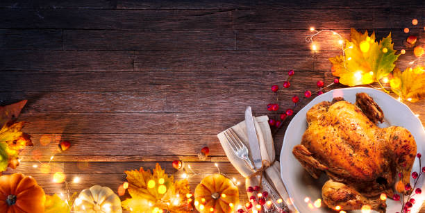 roast turkey - thanksgiving celebration - table setting with autumnal decoration on wooden plank - christmas turkey imagens e fotografias de stock