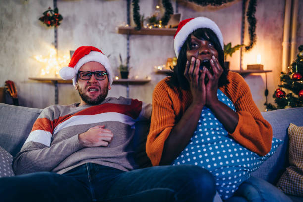 istock Couple scared by horror movie 1352243707